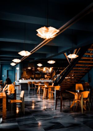 people sitting on chairs inside restaurant