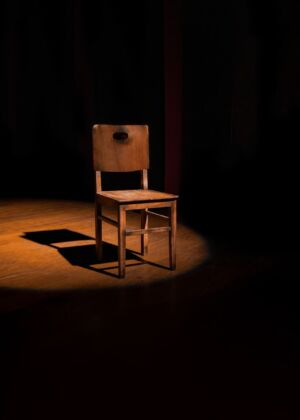 vacant brown wooden armless chair