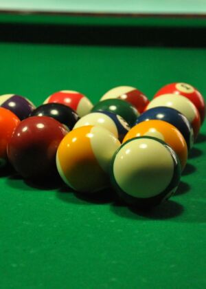 billiard balls on billiard table