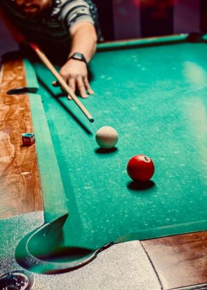 red tomato on green billiard table